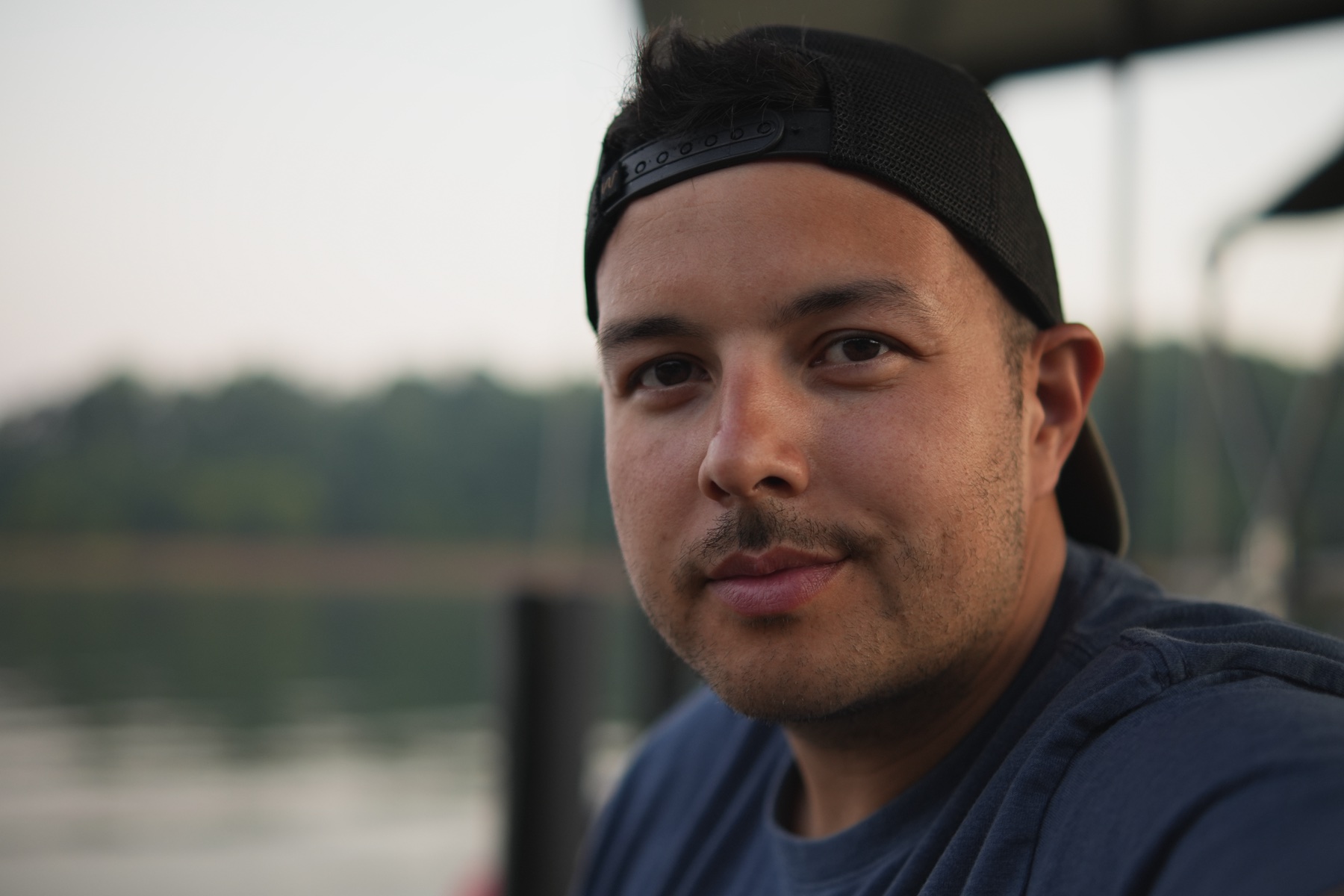 Brad Schultz looking into the camera beside a lake